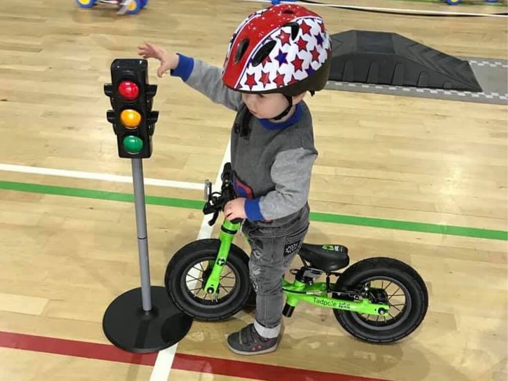 Child on balance bike