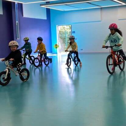 Happy child riding balance bike