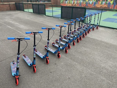 Children participating in Scootability scooter training